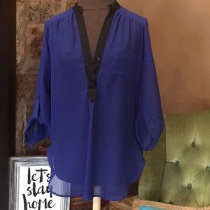 Blue blouse with black trim